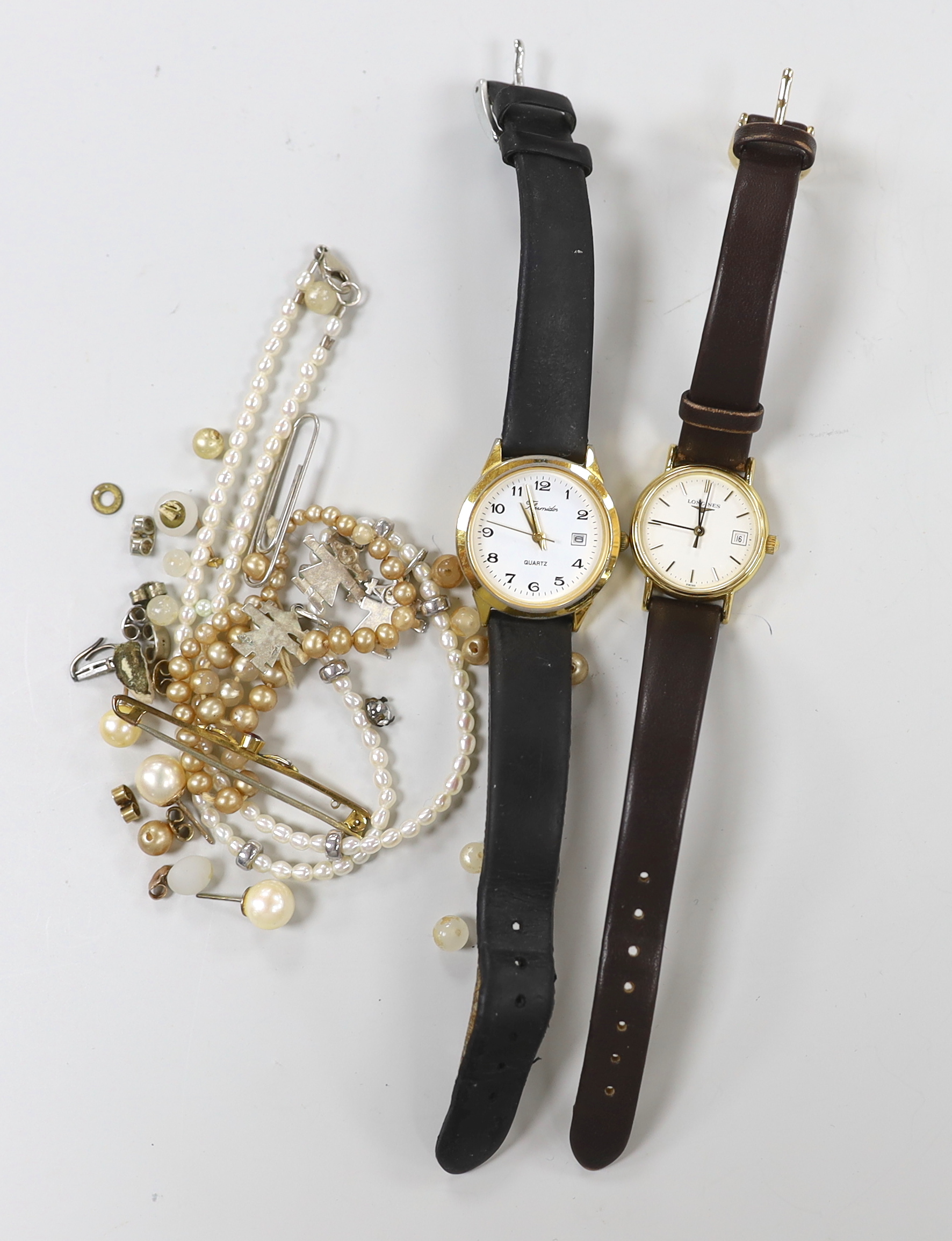 A lady's steel and gold plated Longines quartz wrist watch, one other watch, a 9ct and gem set bar brooch and sundry minor jewellery.